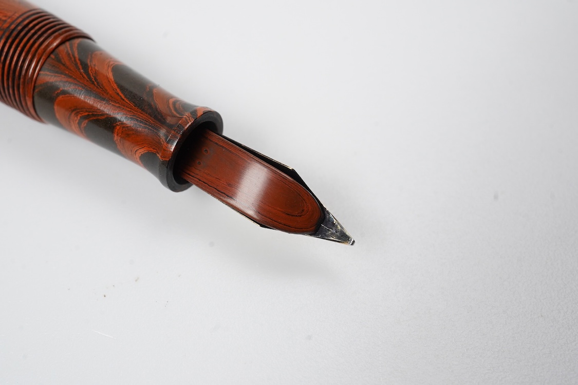 A Waterman Red Ripple No. 5 lever filler with red cap band and fitted with Waterman nib
